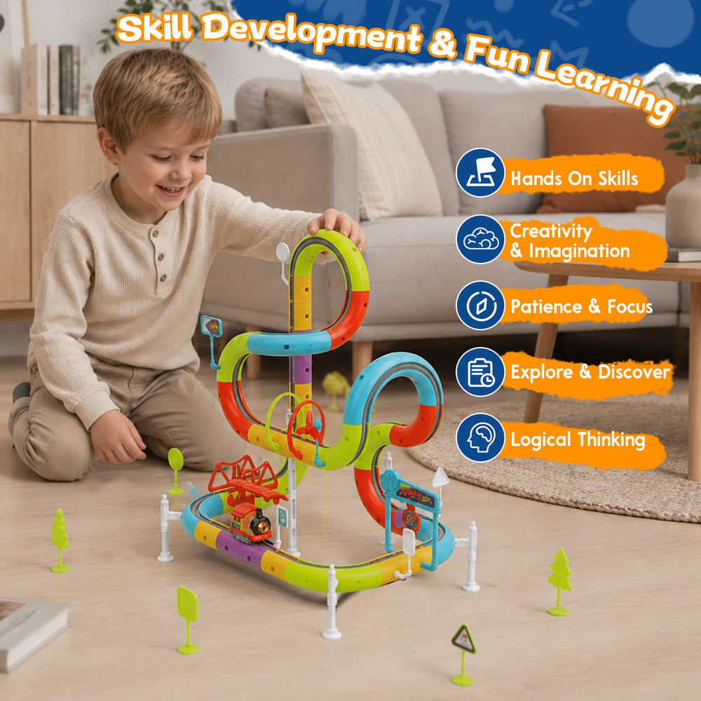 A young boy is playing with a colorful magnetic toy train track